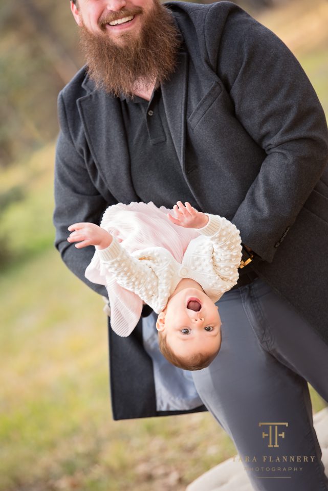 Family Photoshoot with baby upside down