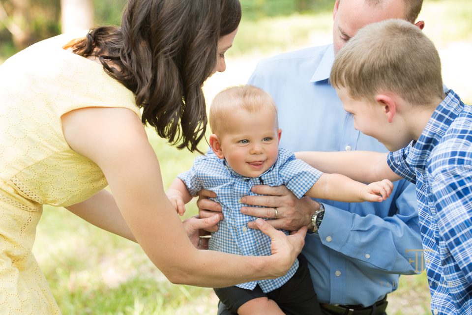 family loving on baby during family portrait session