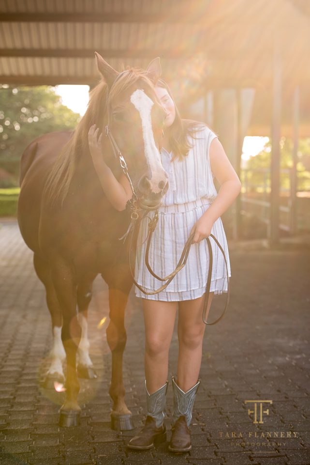 girl posing with her horse