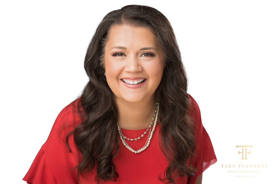 woman in red posing for LinkedIn headshot