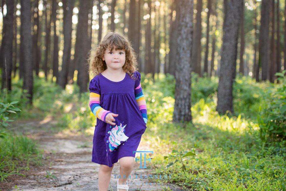 girl running in woods family portraits