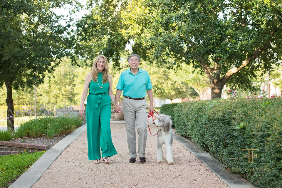 couple walking dog for family pictures