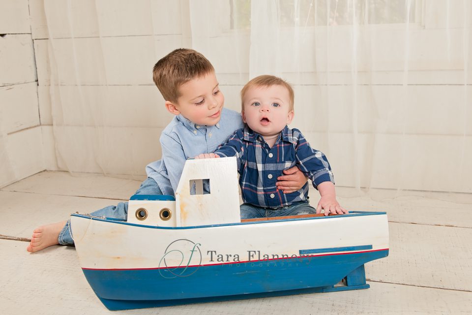 boys with blue boat