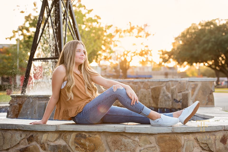 teen girl posing with setting sun