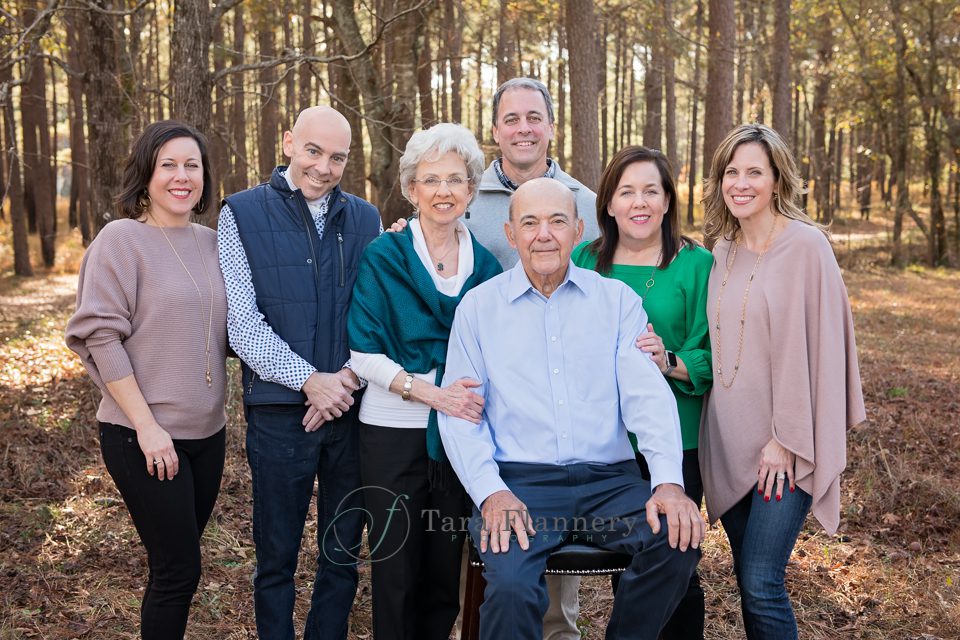 parents and adult children for family pictures in the woods