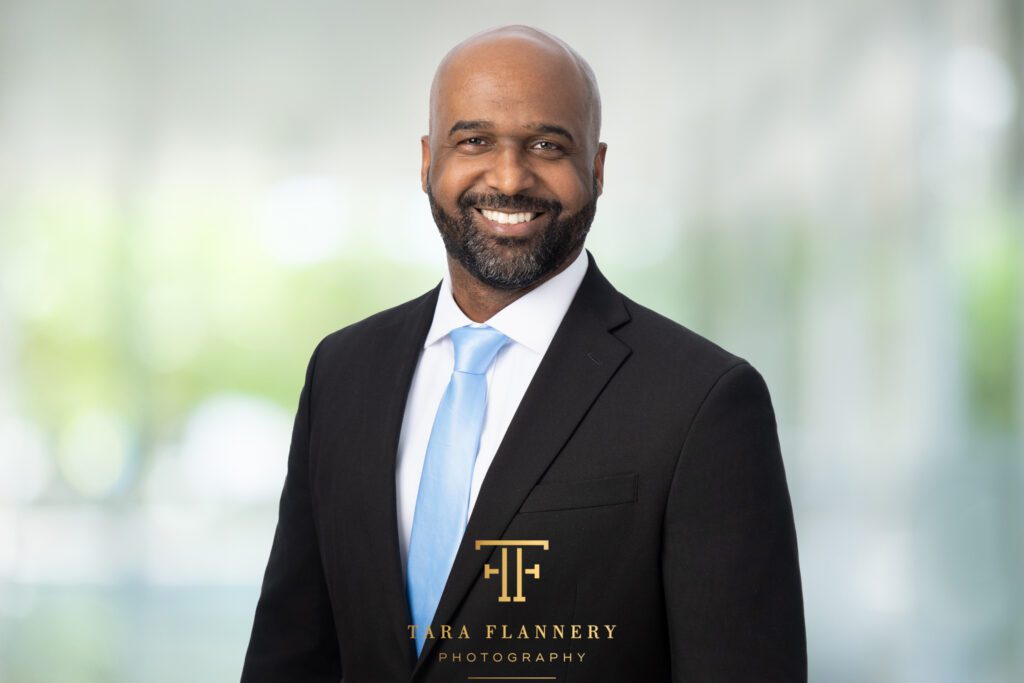 Business professional smiling for a corporate headshot. headshot posing