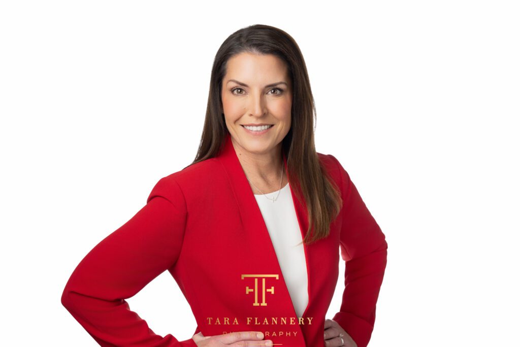 Corporate headshots of woman in red suit smiling. personal branding
