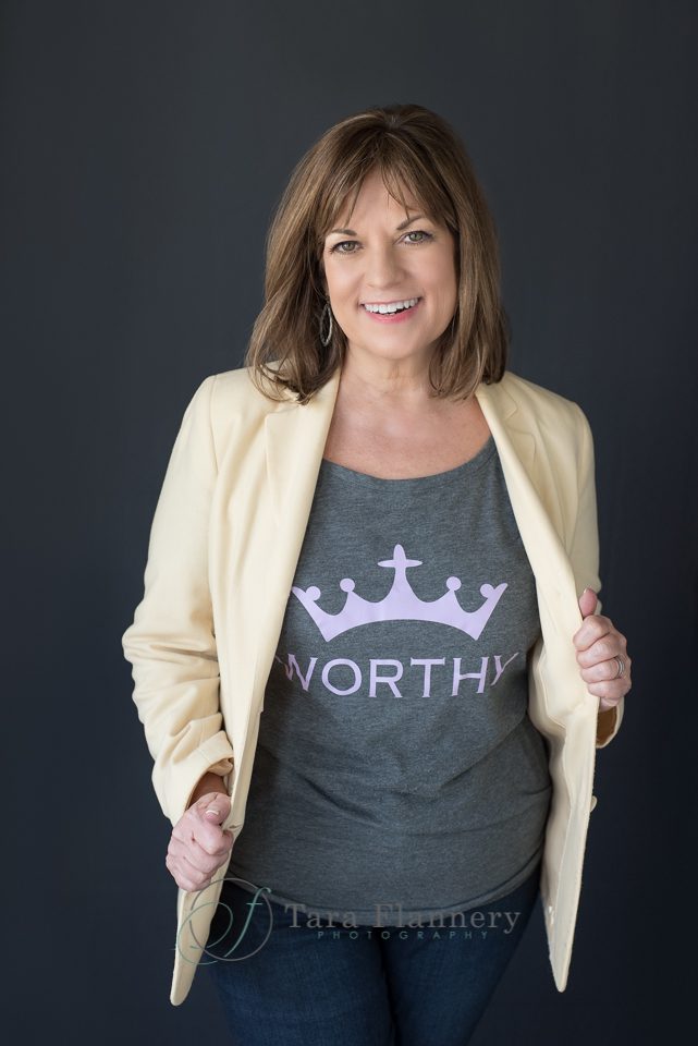woman wearing a tshirt that says "worthy"
