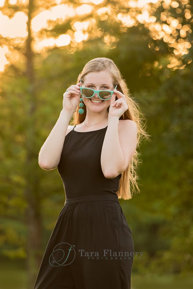 Senior Portraits girl backlit with sunglasses