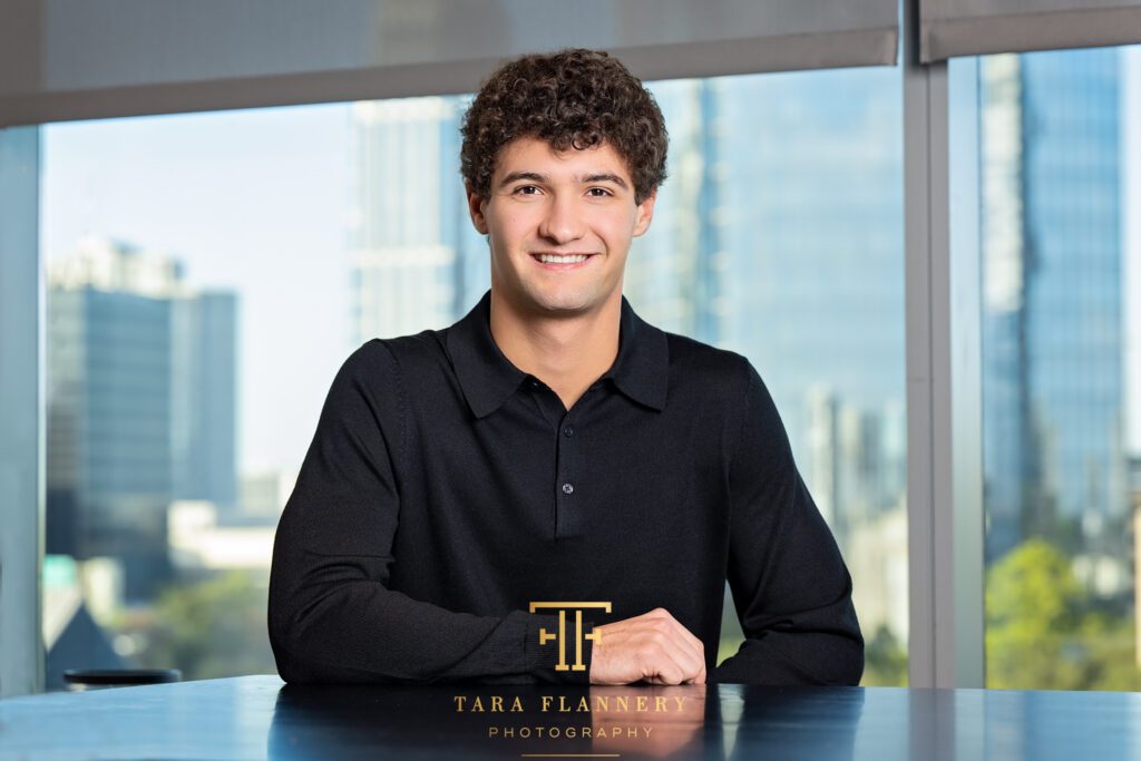Young race car driver poses for a branding image.