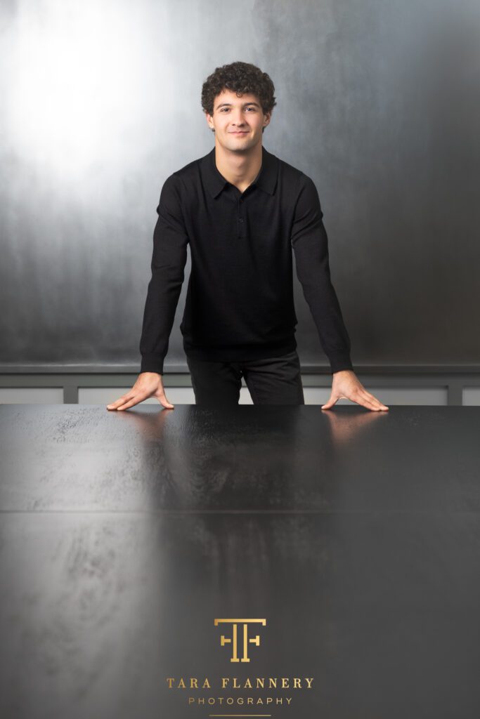 Young race car driver poses for a branding image.