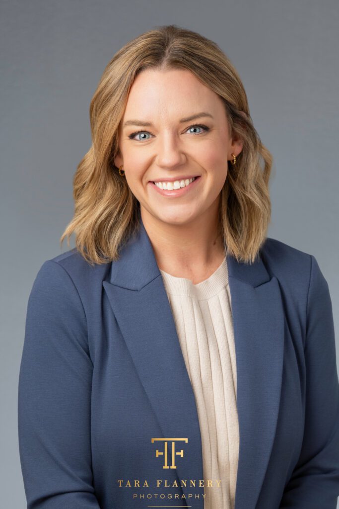 Texas Oncology provider smiles for a professional headshot.