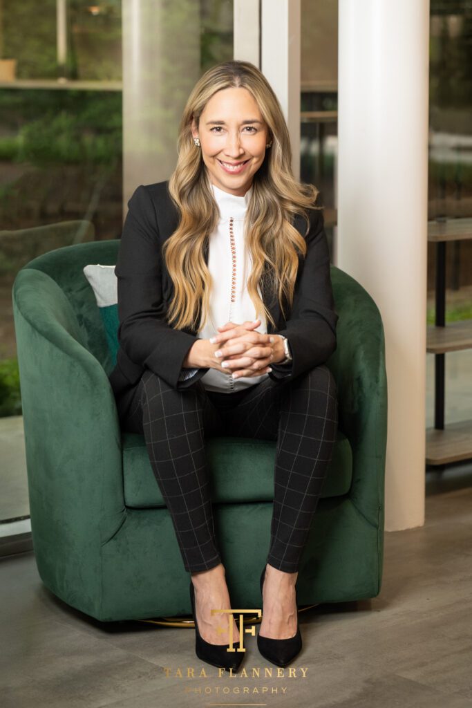Female marketing executive poses for a branding photo in a co-working space in The Woodlands.