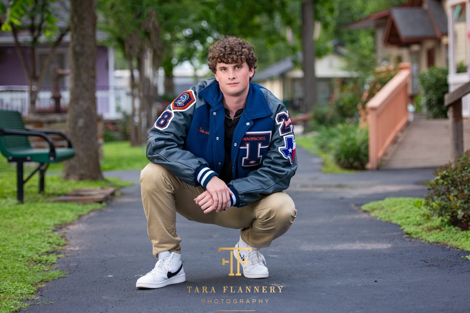 class of 2025 high school senior boy with letter jacket
